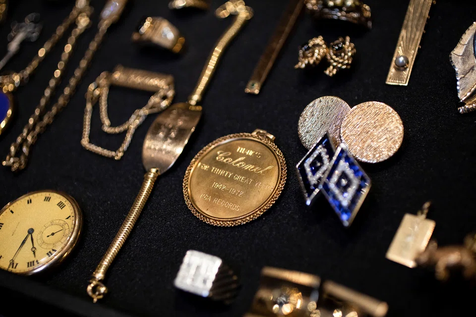 Two hundred items, including gold rings encrusted with jewels, cufflinks, watches and chains, have been brought together by GWS Auctions. Presley's former wife, Priscilla Presley, helped design some of the pieces.