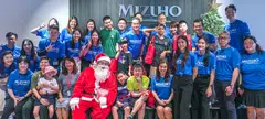 Mizuho Bank and Mizuho Securities employees together with students and staff from AWWA's Special Student Care Centre on Dec 23.