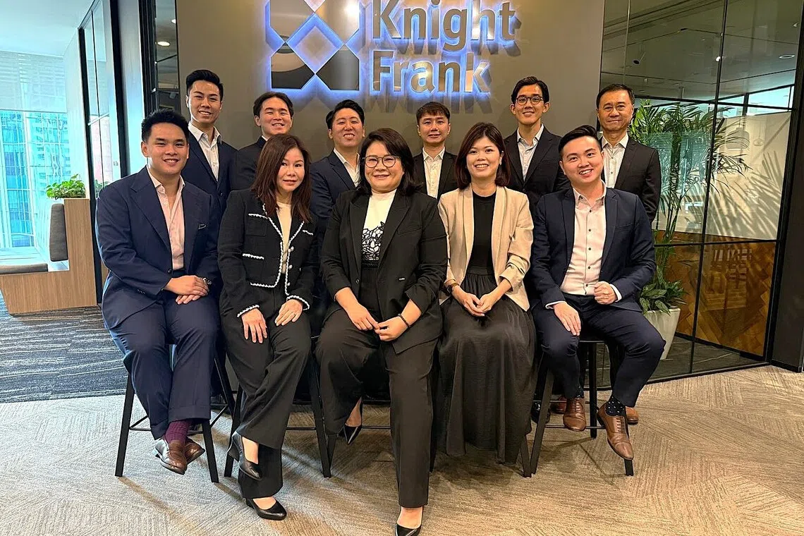 Tridiana Ong (front row, centre) leads a team of 16, including three brokers who previously worked with her at Colliers Singapore. 