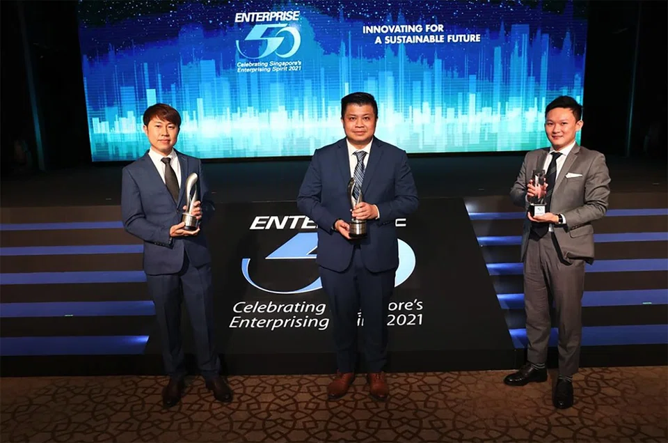 Oilfield Services & Supplies general manager Michael Lim, managing director Kay Ong and business development manager Kenneth Loh at the Enterprise 50 Awards 2021 ceremony.