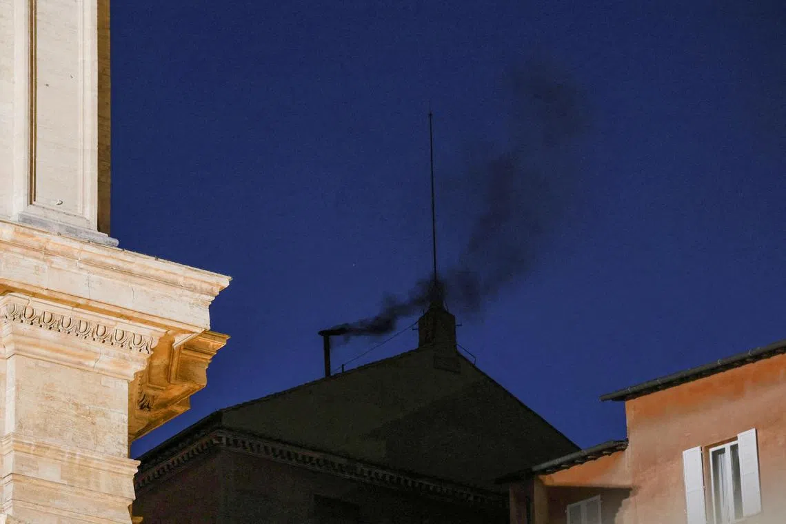 Black smoke rises from the chimney on the Sistine Chapel, indicating no decision has been made to elect a new pope, Vatican, May 7, 2025. 