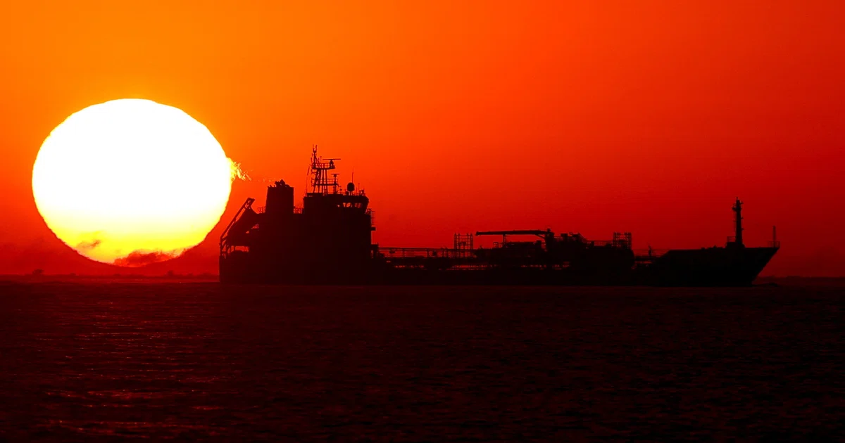 Oil edges lower from six-month high as traders assess Iran risks