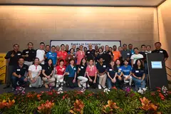 Minister of State for Home Affairs Muhammad Faishal Ibrahim (second row, in pink) is flanked by ABS chairman Piyush Gupta and ABS director Ong-Ang Ai Boon at the launch of the Community Giveback Programme.