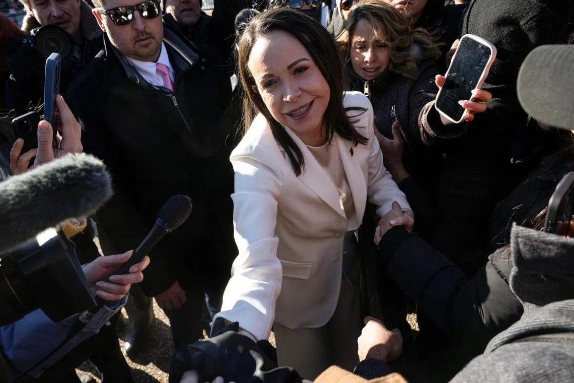 Venezuelan opposition leader Maria Corina Machado greets supporters as she departs the White House following a meeting with U.S President Donald Trump in Washington, D.C., Jan 15, 2026. 