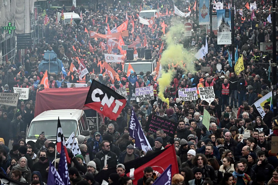 Protesters on a second day of nationwide strikes and protests over the government's proposed pension reform, on Jan 31, 2023, in Nantes, France.  Debate in parliament on the French government's plan to reform the pension system, which includes raising the minimum retirement age, began on Feb 6, 2023, with a third day of nationwide strikes and protests against the bill planned for Feb 7. 