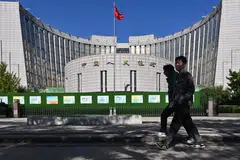 The one-year loan prime rate will stay at 3.10 per cent and the five-year rate remains at 3.60 per cent, according to a statement from the People’s Bank of China (top).
