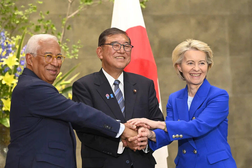 Ursula von der Leyen, President of the European Commission (right), European Council President Antonio Costa (left) with Japanese Prime Minister Ishiba Shigeru (centre) pose and shake hands prior to a meeting at the Prime Minister Office in Tokyo Japan on Jul 23. 