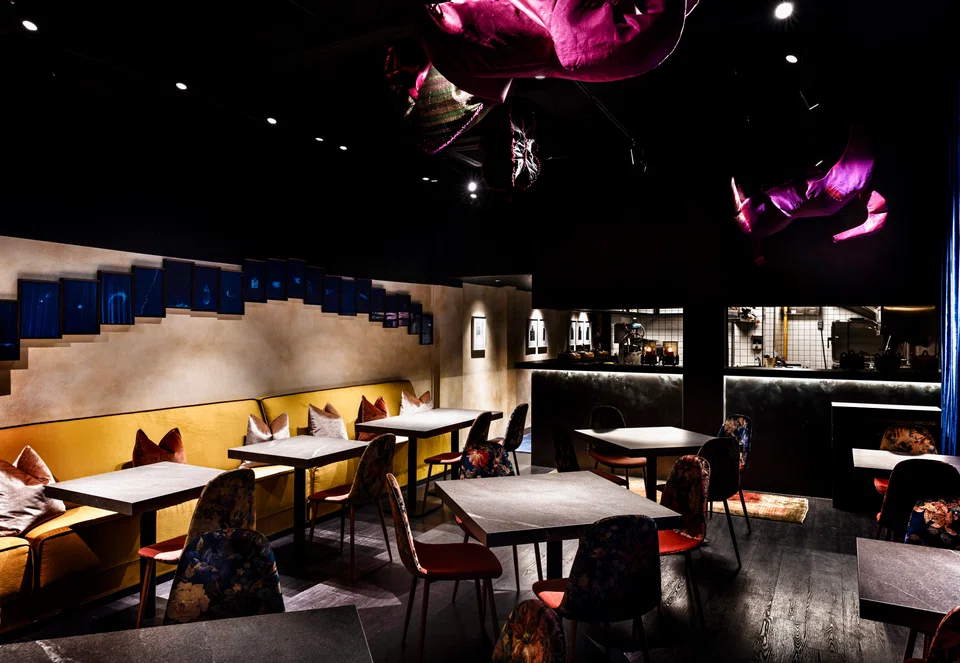 Ahāra's dining room is adorned with modern artwork.