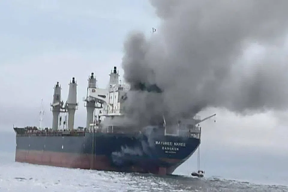 A Thai-flagged bulk carrier, was set ablaze, forcing the evacuation of crew, with three people reported missing and believed trapped in the engine room.