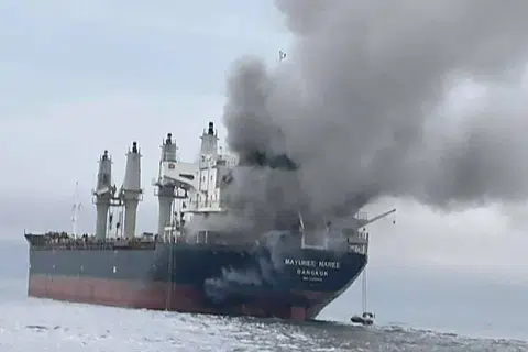 A Thai-flagged bulk carrier, was set ablaze, forcing the evacuation of crew, with three people reported missing and believed trapped in the engine room.