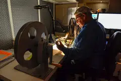 A specialist checking film. Old and new films all have to be stored – with the utmost care and under tight security.
