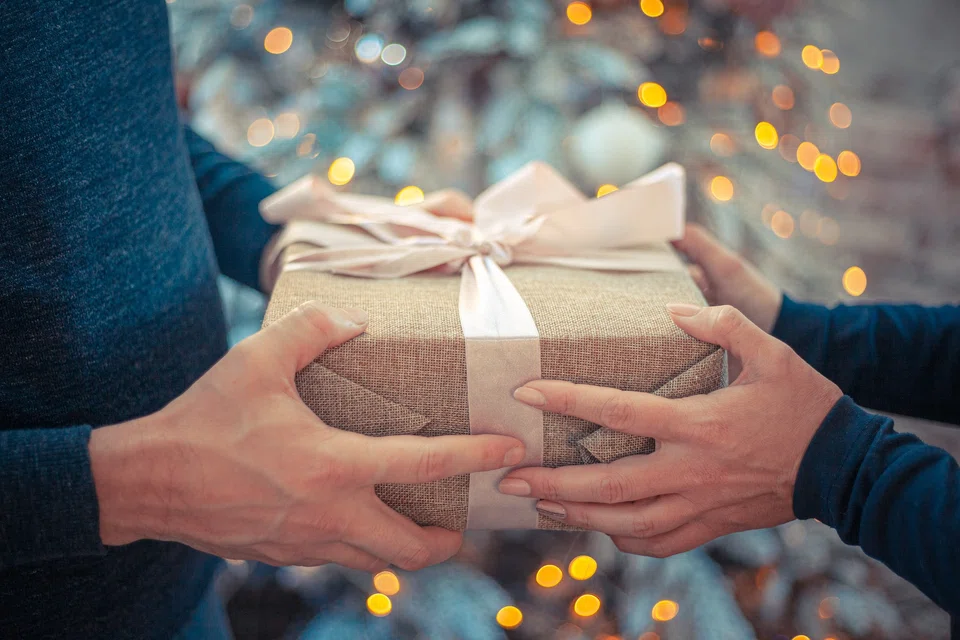 Give gifts to people at work only if you want to, and put some thought into it when you do.
