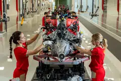 Workers at Ferrari’s new assembly plant in Maranello putting together an engine for a Purosangue.