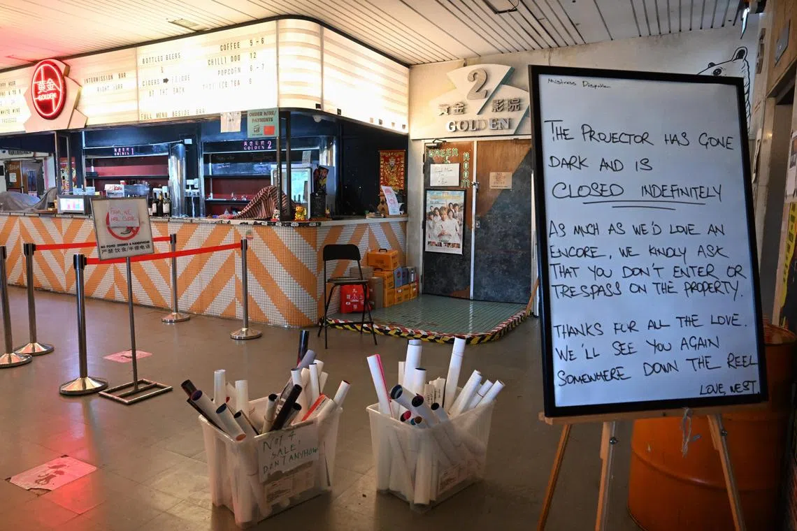 A signage announcing its closure and free posters for the public are seen at The Projector taken on Aug 19, 2025.