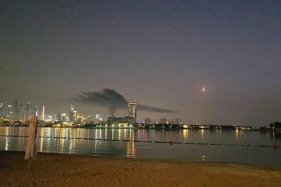 Smoke rising over a damaged hotel in Dubai's famed Palm Jumeirah on Feb 28.
