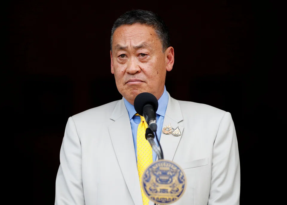 Srettha Thavisin speaks to the media after he was dismissed from his post for breaching ethical rules.