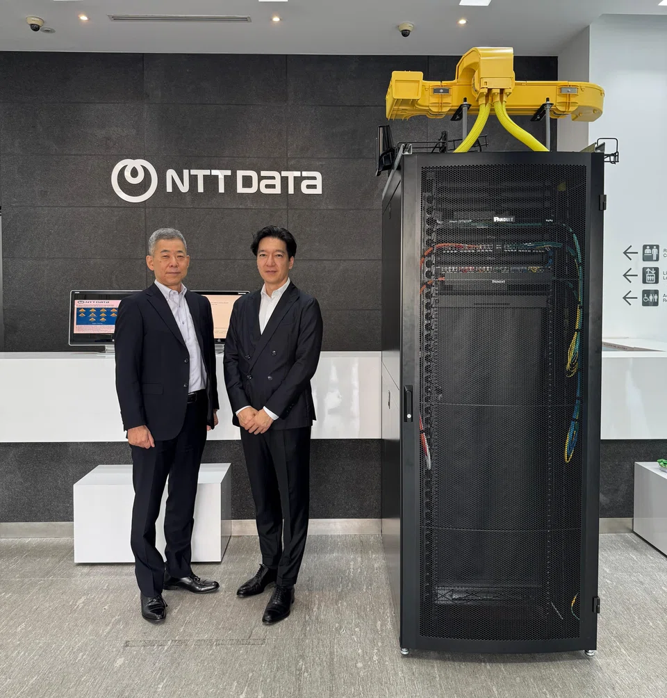Masayuki Ozaki (right), chief financial officer of the manager of NTT DC Reit, says the US$1 billion is a "good bite size" for the market to absorb. With him is Yutaka Torigoe, chief executive officer of the Reit manager.