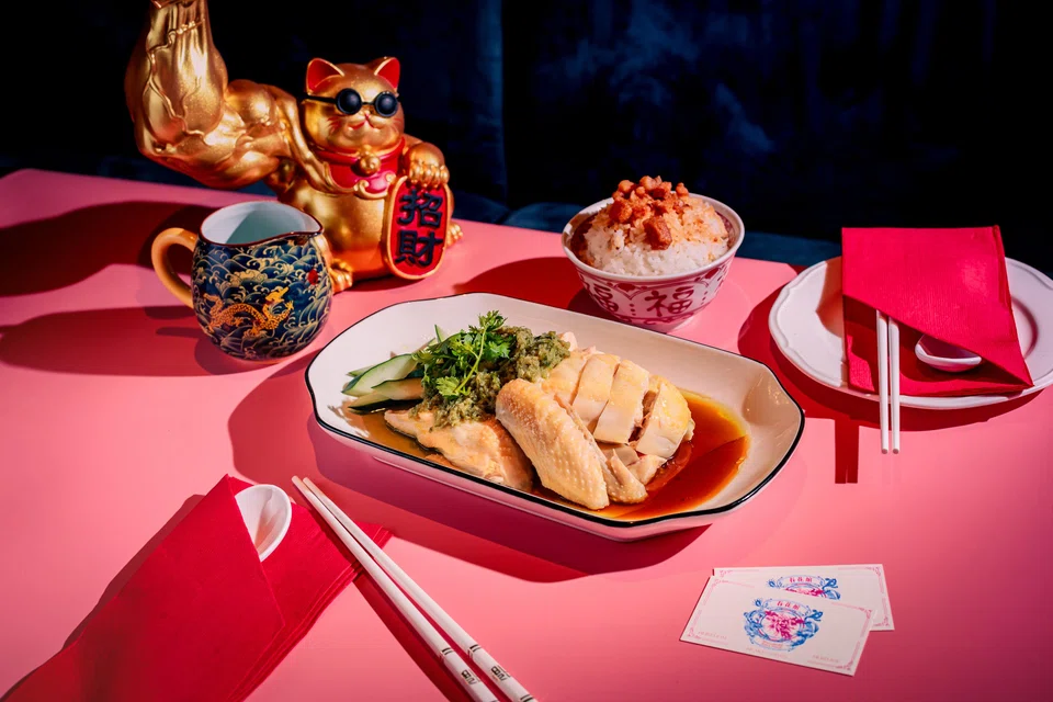 Hainanese kampong chicken is served with green onion sauce.