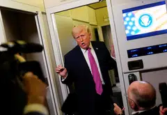 US President Donald Trump talks to members of the media aboard Air Force One en route to Joint Base Andrews, Maryland, March 29, 2026. 