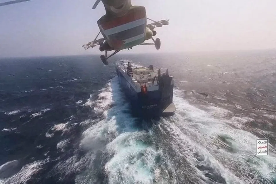 A Houthi military helicopter flying over the cargo ship Galaxy Leader in the Red Sea in November. 
