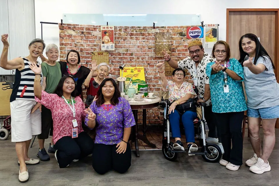 Seniors, care staff and volunteers at Lucky Haven Senior Activity Centre for a breakfast event.