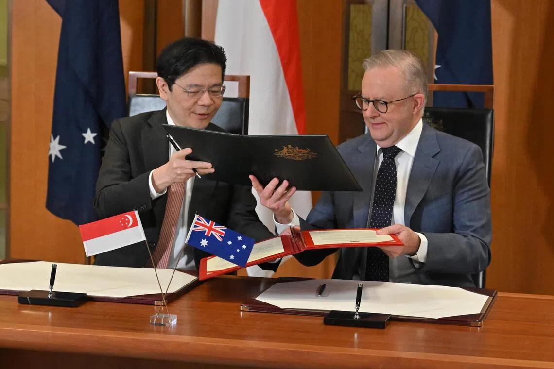 PM Wong (left) and Australian PM Anthony Albanese signed a Comprehensive Strategic Partnership agreement in Canberra on Oct 8, 2025.