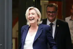 French far-right leader Marine Le Pen and RN Mayor of Perpignan Louis Aliot leave the party's headquarters in Paris, France, July 2, 2024. French people go to polls on July 7 for the decisive final round of the snap election President Emmanuel Macron called after his camp received a drubbing in European elections last month. 