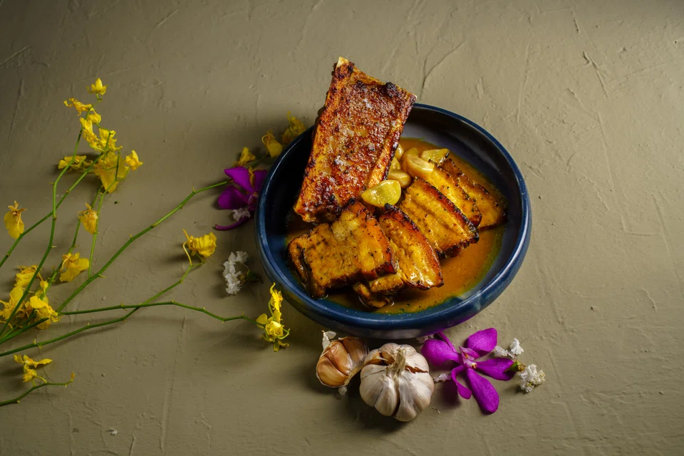 Adobong dilaw of Duroc pork belly and bone marrow.
