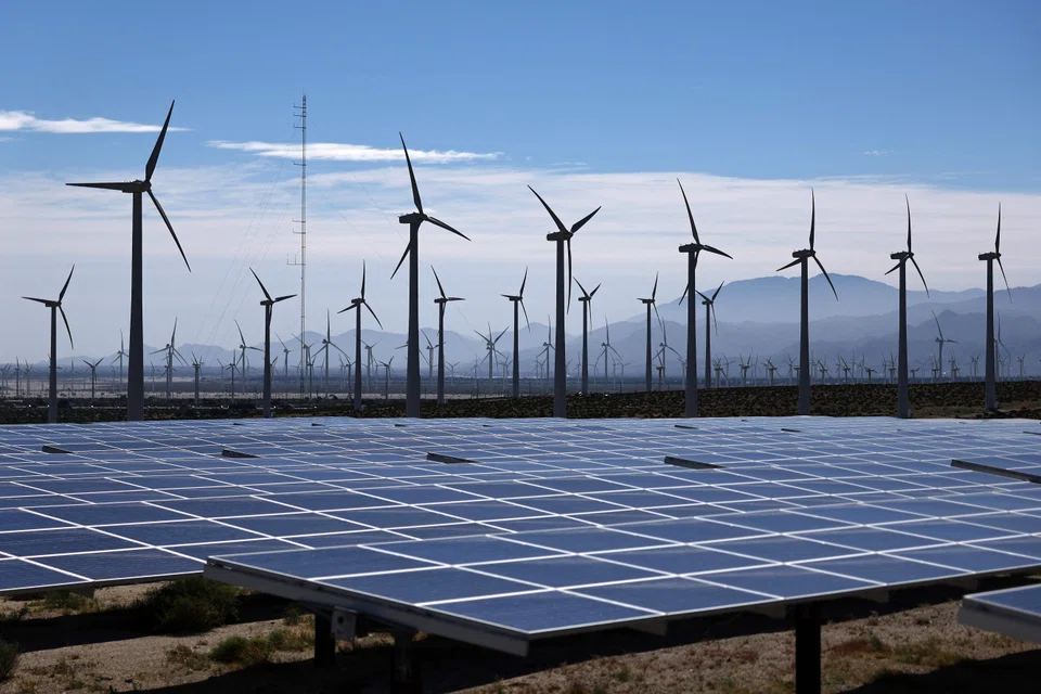 PALM SPRINGS, CALIFORNIA - MARCH 06: Wind turbines operate at a wind farm near solar panels on March 06, 2024 near Palm Springs, California.   Mario Tama/Getty Images/AFP (Photo by MARIO TAMA / GETTY IMAGES NORTH AMERICA / Getty Images via AFP)