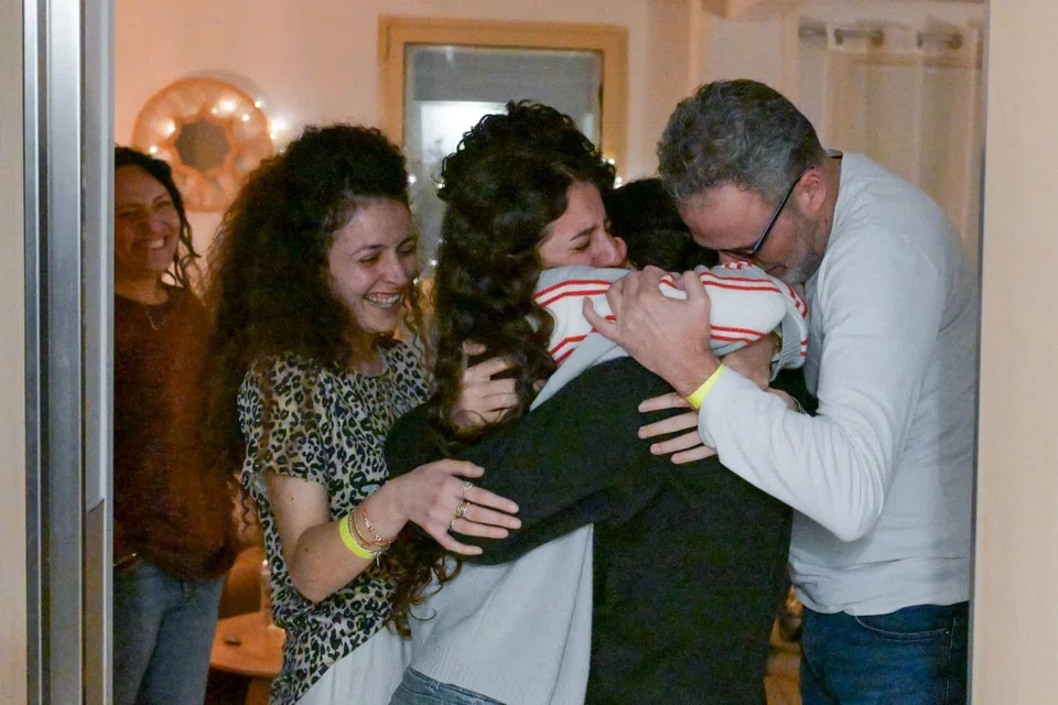 Released hostage Romi Gonen embraces loved ones at Sheba Medical Centre in Ramat Gan, Israel, after being held in Gaza since the deadly Oct 7, 2023 attack by Hamas, Jan 19, 2025.    