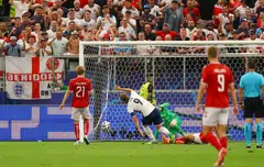 England's Harry Kane scores the first goal
in their match against Denmark in Frankfurt, Germany, June 20, 2024.