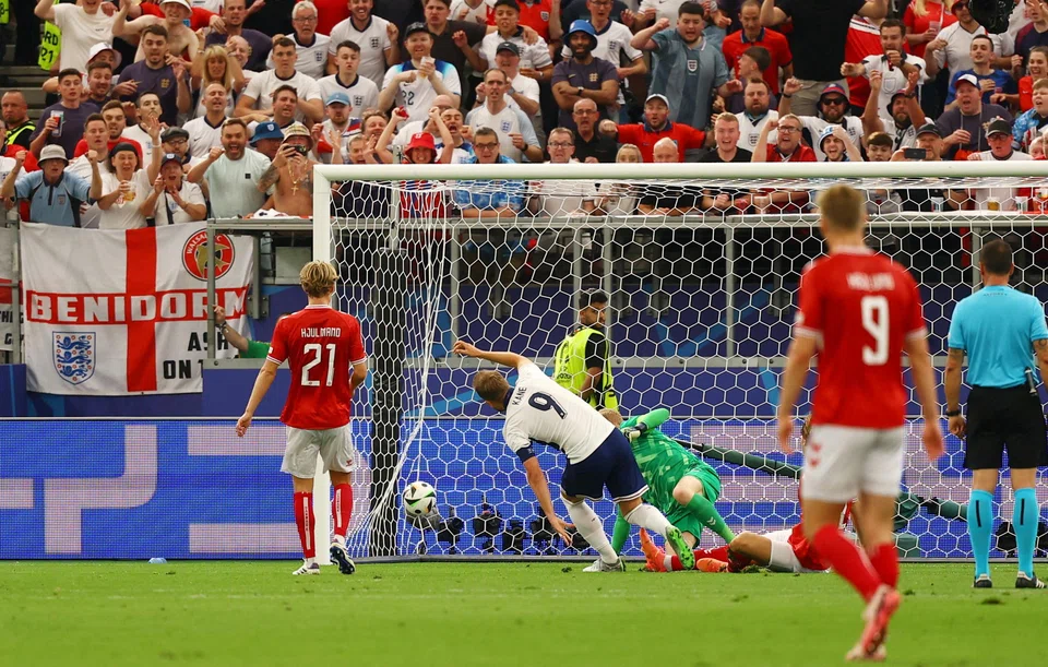 England's Harry Kane scores the first goal
in their match against Denmark in Frankfurt, Germany, June 20, 2024.