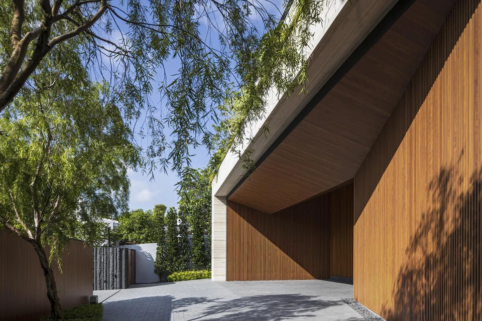 The car porch is integrated beneath the second storey.