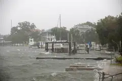 The Shore Acres neighborhood begins to flood from high tide in the Tampa Bay while Tropical Storm Debby approaches the gulf coast, in St. Petersburg, Florida, August 4, 2024. 