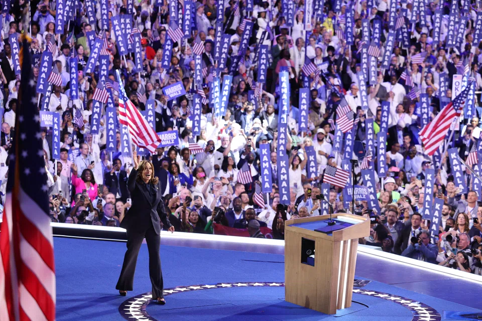 Democratic presidential nominee and US Vice-President Kamala Harris waves after speaking at the Democratic National Convention in Chicago, Illinois, Aug 22, 2024. 