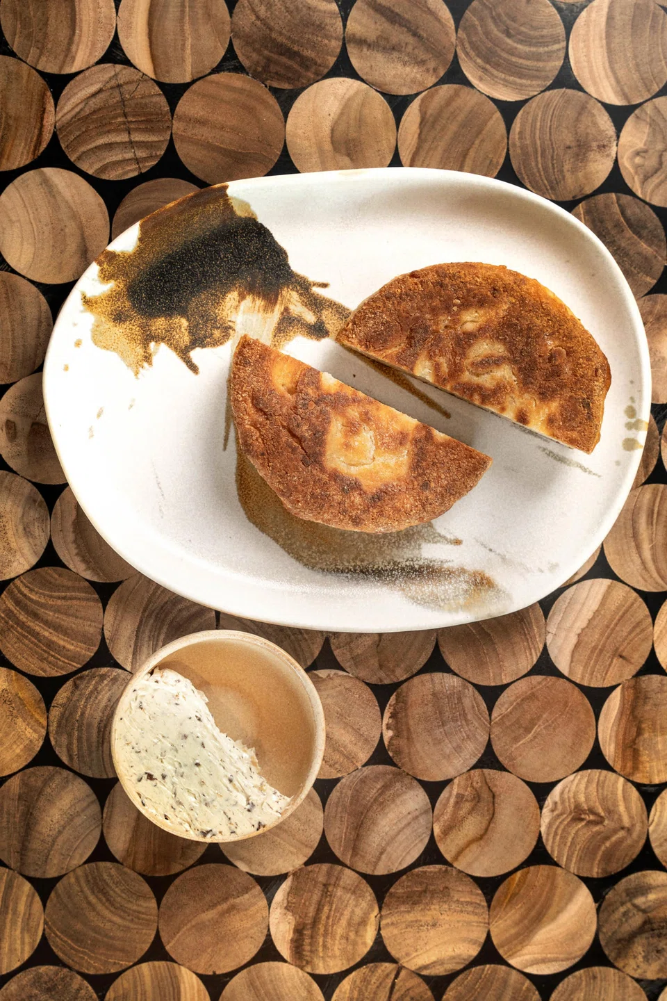 The fermented cassava bread is dense and chewy, served with mushroom butter.