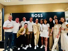 HSBC Women's World Championship 2025 winner Lydia Ko (centre, in yellow) together with the Hugo Boss team that's taking part in this year's BT Corporate Golf League. 