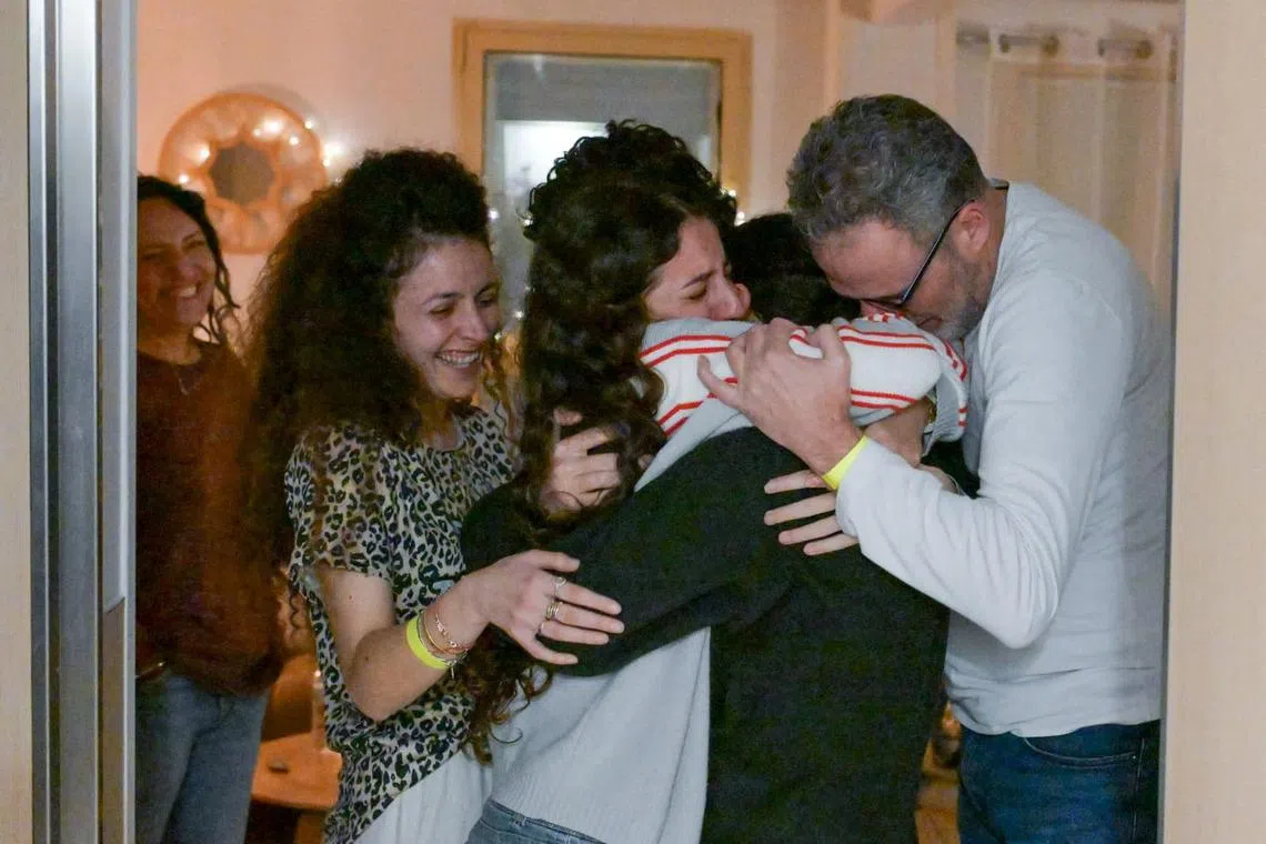 Released hostage Romi Gonen embraces loved ones at Sheba Medical Centre in Ramat Gan, Israel, after being held in Gaza since the deadly Oct 7, 2023 attack by Hamas, Jan 19, 2025.    