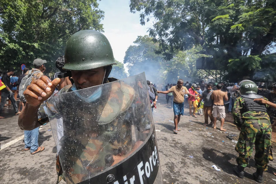 Security forces fire tear gas to disperse protesters as they try to enter the Prime Minister's office in Colombo, Sri Lanka. The crisis holds lessons for other countries too.