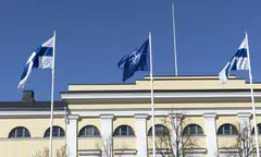 The flags of Finland and Nato fly in front of the Finnish Foreign Ministry building in Helsinki, after the country became the 31st Nato member on 4 Apr 2023.