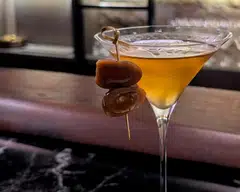 Kill Me Softly is a Japanese twist on a classic dirty martini, topped with a marinated quail egg.
