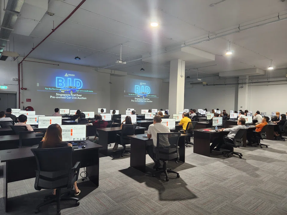 Under the live auction system, Dickson first purchases the used car from the owner, then puts it up for auction.  