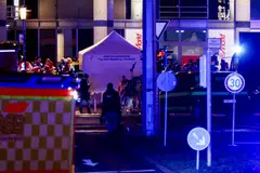 Emergency personnel work at a Christmas market after a car drove into a group of people, according to local media, in Magdeburg, Germany.