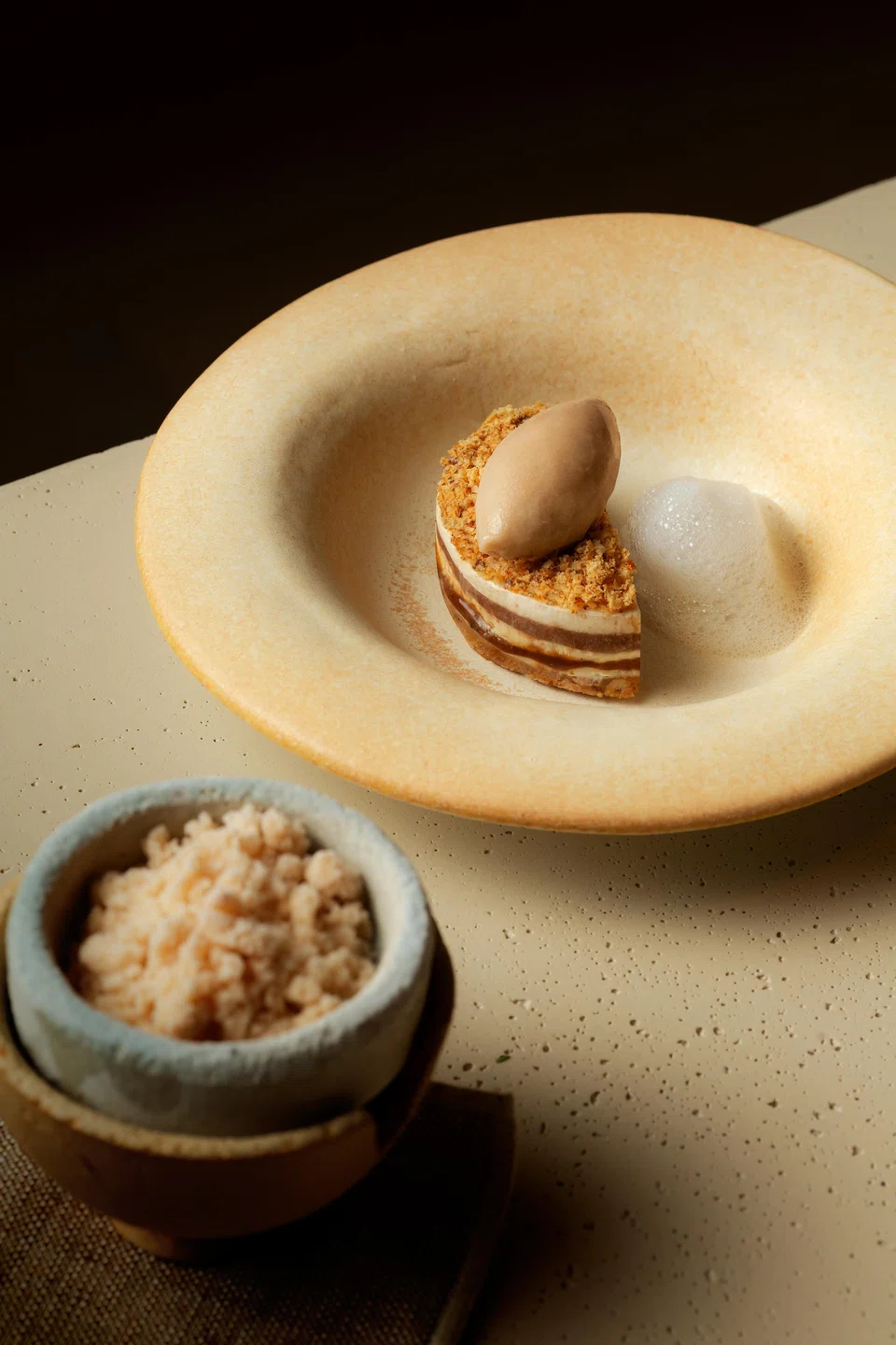 Walnut mousse and lemon foam dessert.