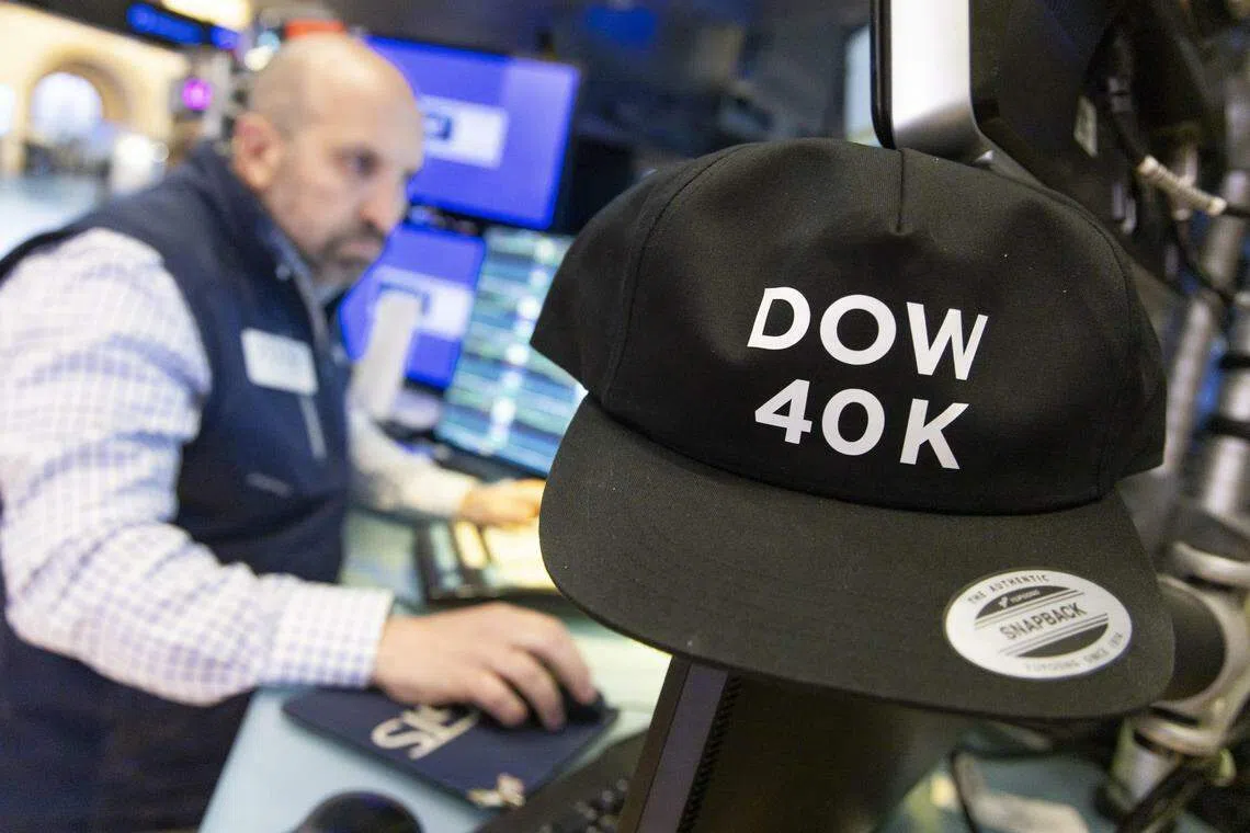 A trader on the floor as the Dow Jones industrial average again edged toward breaching 40,000 at the New York Stock Exchange on May 17, 2024. 