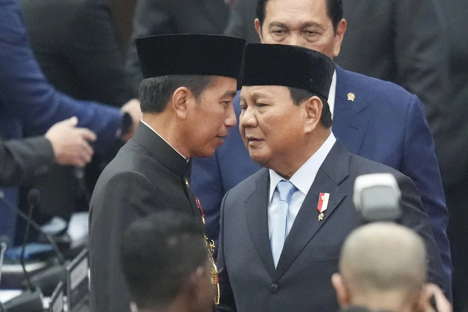 Widodo (left) talks to Prabowo after delivering his final state address on Friday; Widodo has been laying the groundwork for a seamless transition by supporting initiatives championed by Prabowo.