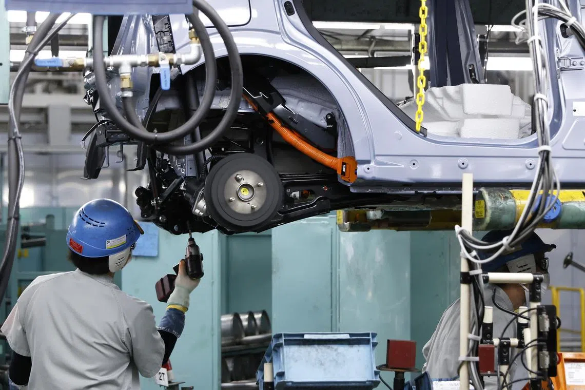 A worker assembles a kei electric vehicle on the production line at the Mitsubishi Motors Corp Mizushima plant in Kurashiki, Okayama prefecture, Japan, May 19, 2022. Availability of specialist skills in design, engineering and manufacturing is one key consideration in nearshoring.