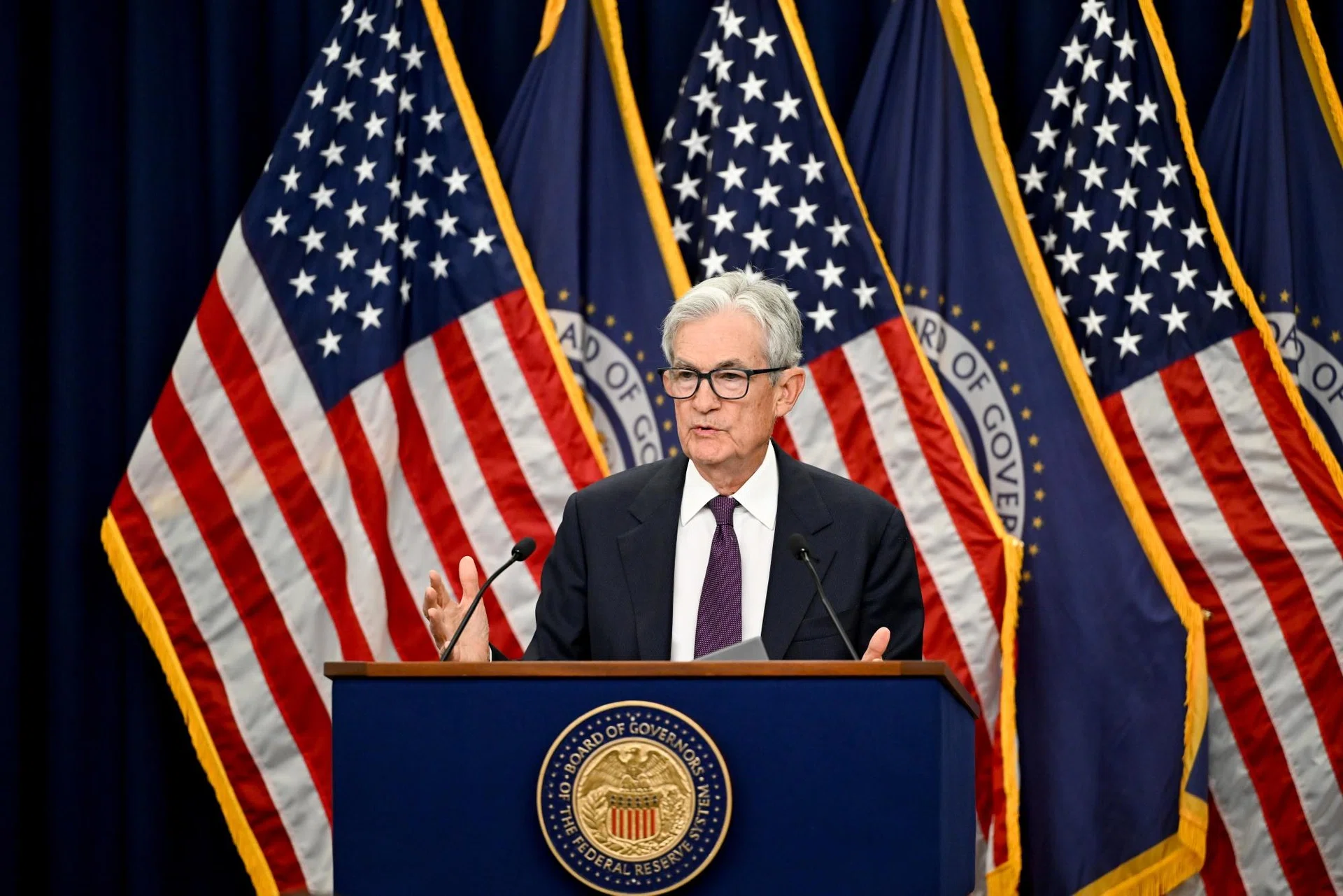 Divided Fed officials hold rates; Powell to stay as governor