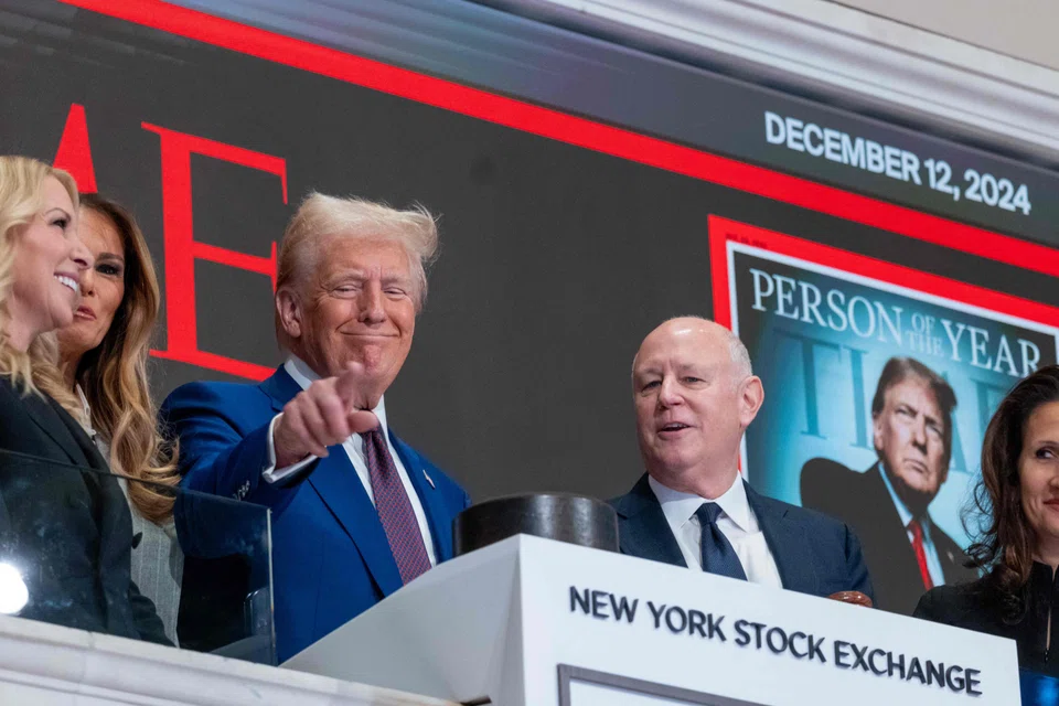 US President-elect Donald Trump rings the opening bell on the trading floor of the New York Stock Exchange (NYSE) on Dec 12, using the occasion to make fresh pledges to cut taxes.