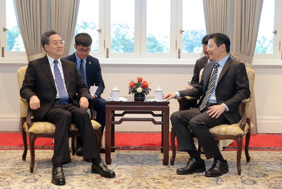 Visiting Chinese Vice-Premier Ding Xuexiang meeting Prime Minister Lawrence Wong in Singapore on Nov 11. 